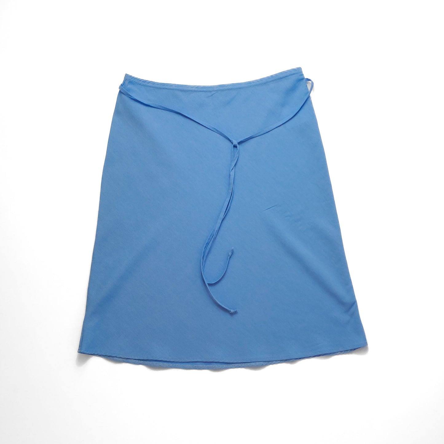 Blue midi wrap skirt with a tie waist, laid flat on a white background.