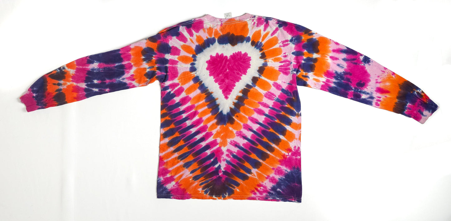 Colorful long-sleeve tie-dye shirt with a symmetrical heart pattern in the center, featuring vibrant hues of pink, orange, purple, and white.