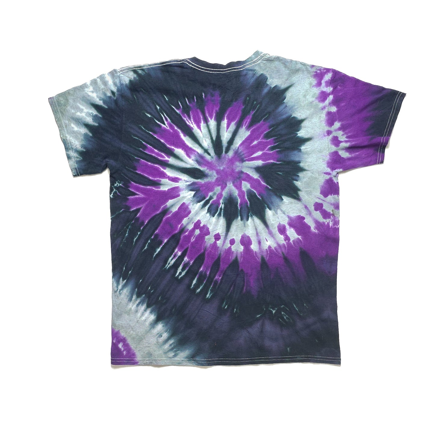 A tie-dye t-shirt with a spiral pattern featuring purple, white, and dark blue colors, laid flat on a white background.