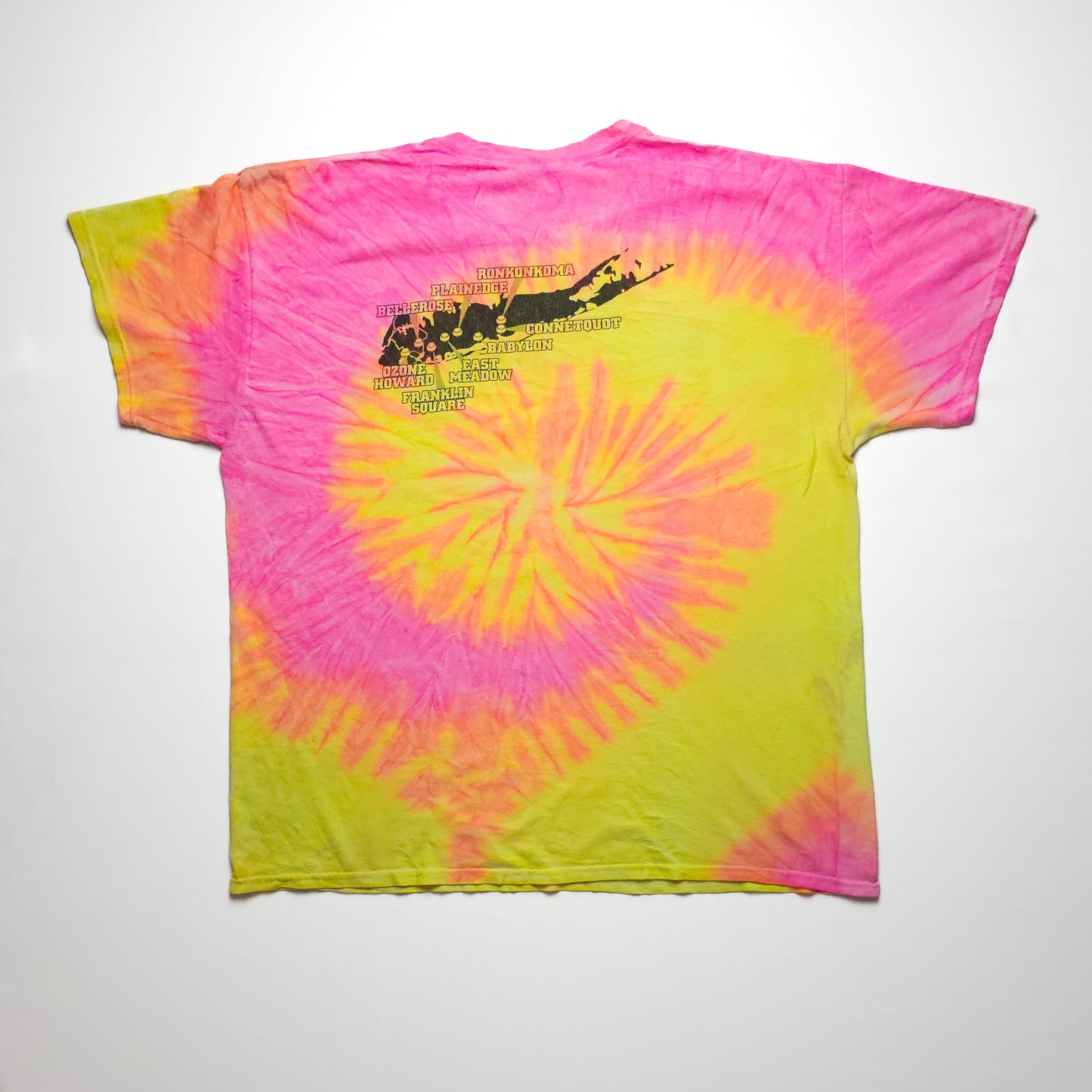 A colorful tie-dye T-shirt featuring vibrant pink, yellow, and orange swirls, with black text and abstract design on the back.