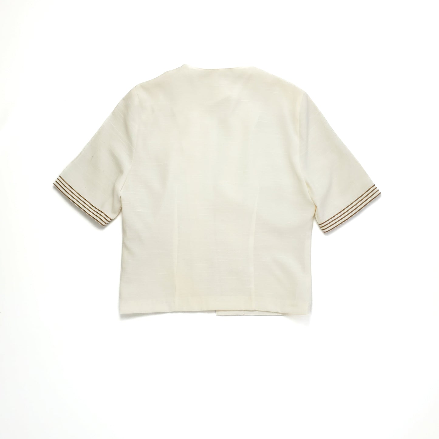 A short-sleeve cream shirt with brown striped accents on the sleeve cuffs. The shirt is laid flat against a white background, showing the back view.