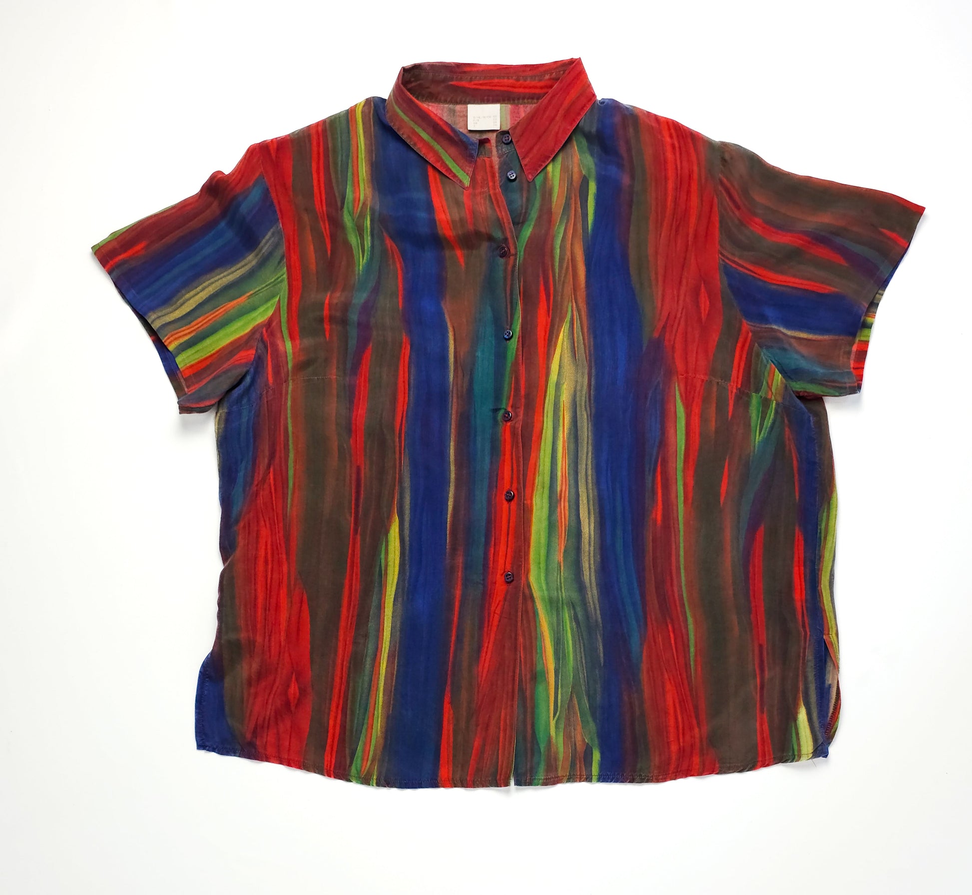 A colorful blouse featuring horizontal stripes in red, blue, and green with short sleeves and a button-up front.