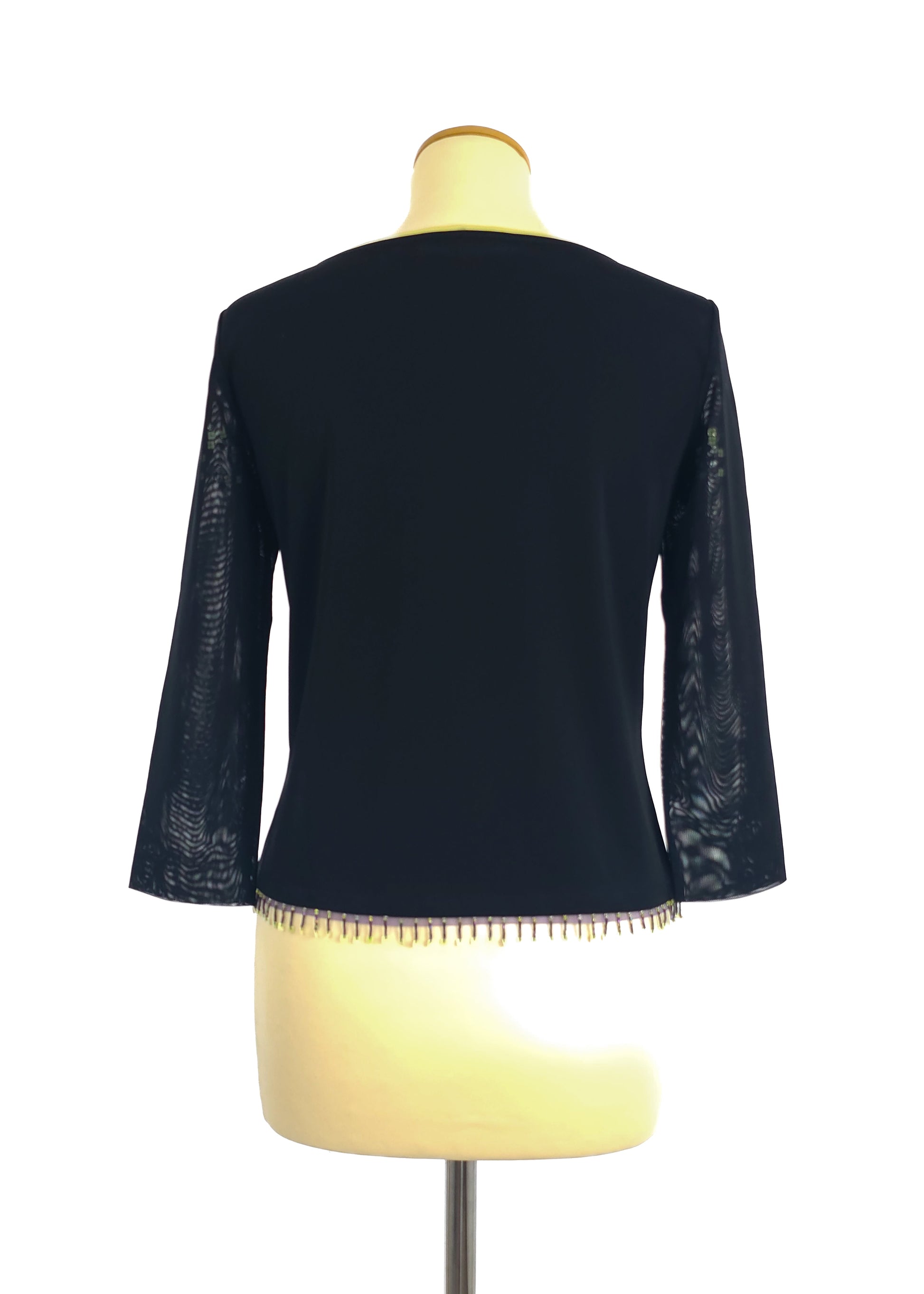 A black long-sleeve top with lace detailing on the sleeves and beaded fringe at the hem, displayed on a mannequin, viewed from the back.