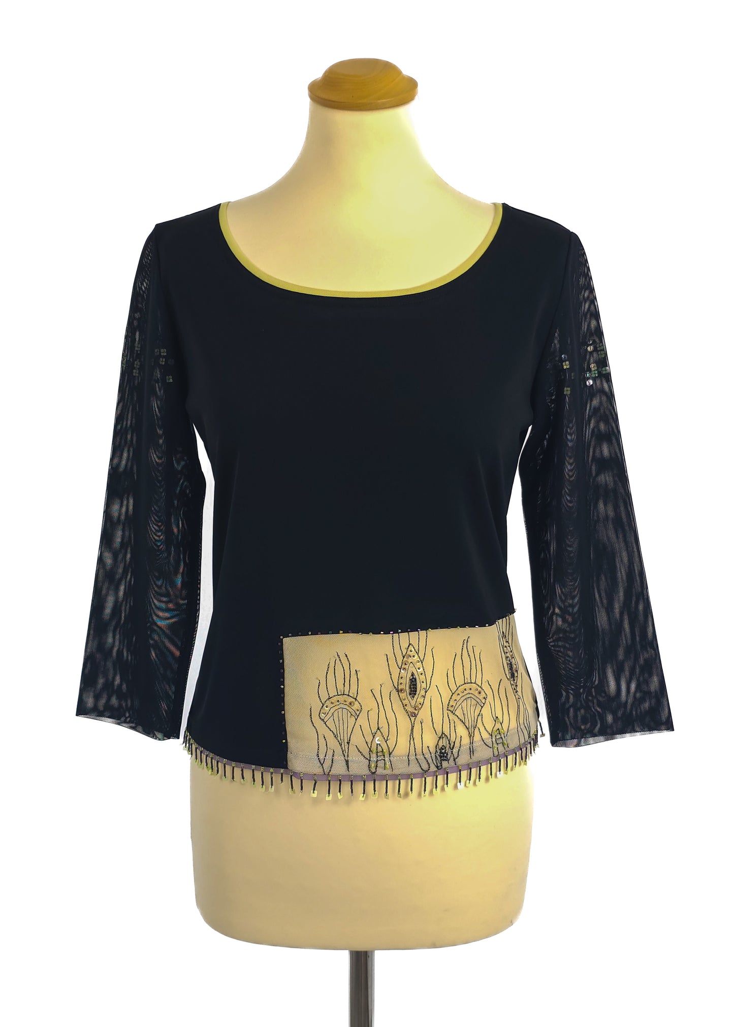 Black T-shirt with lace three-quarter sleeves and embroidered hem on a mannequin.