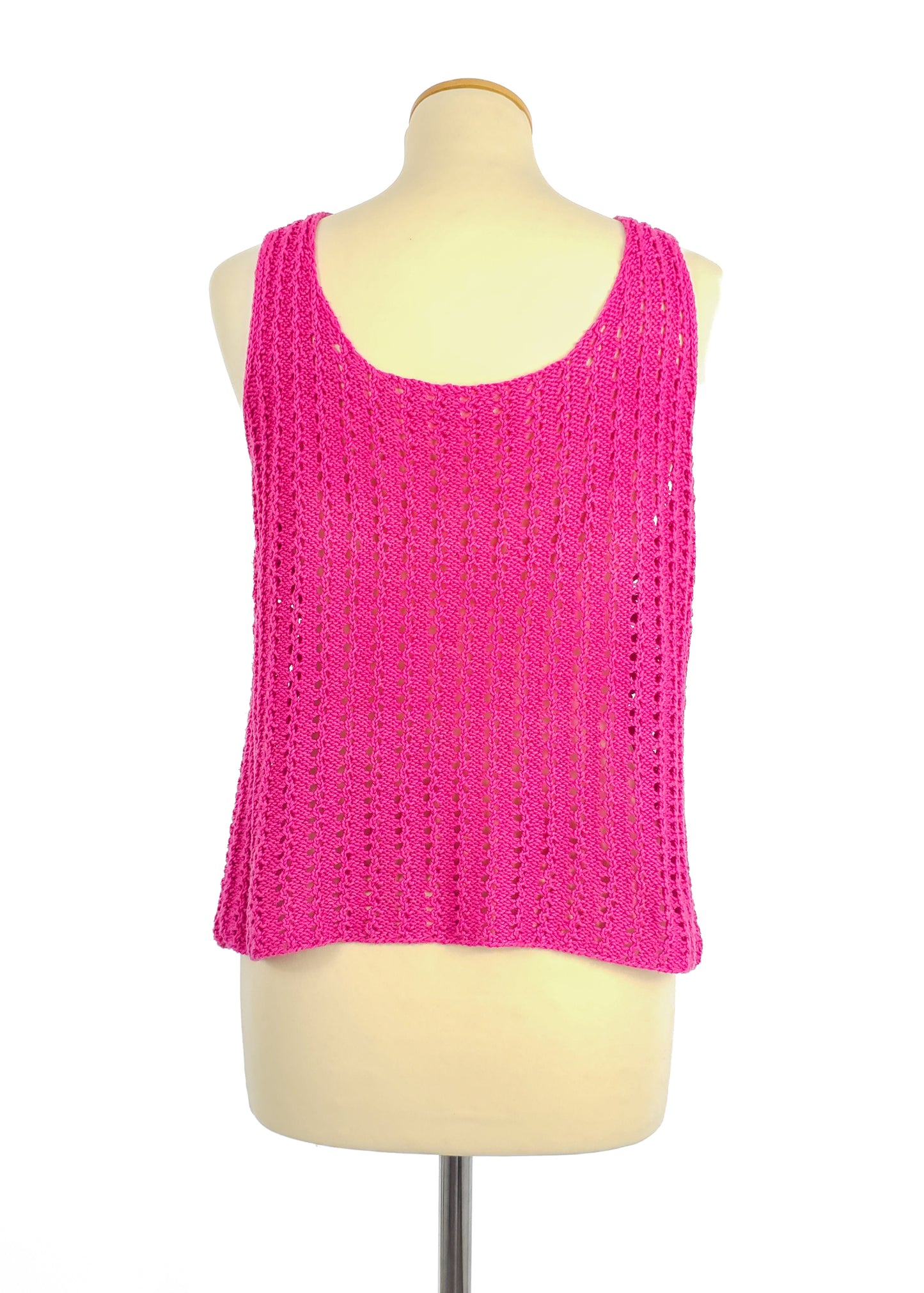 Pink sleeveless crochet knit tank top displayed on a mannequin, featuring a round neckline and a loose, airy design.