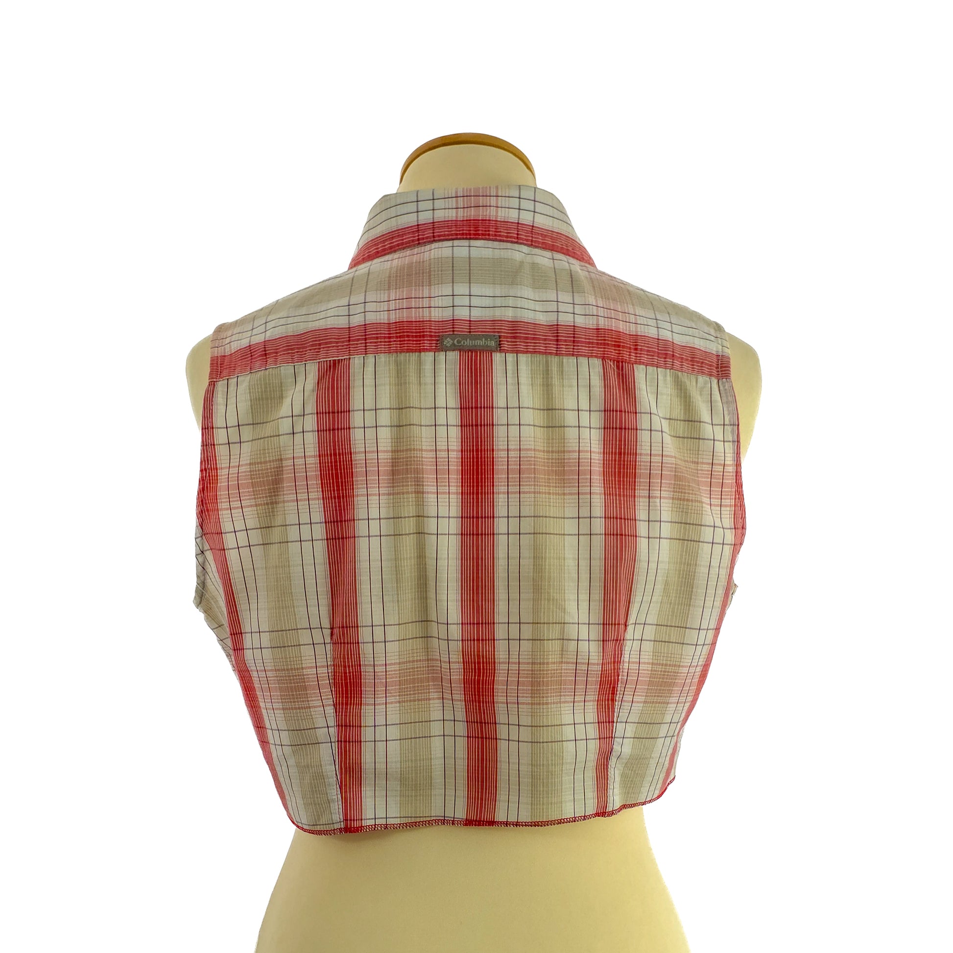 A sleeveless, red and cream plaid cropped top displayed on a mannequin, showing a button-up back with a small brand label near the collar area.