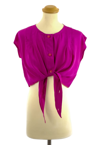 Bright fuchsia, short-sleeve blouse with button front and tie detail.