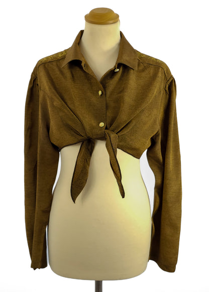 Brown long-sleeve tie-front top on a mannequin with collar and gold buttons.