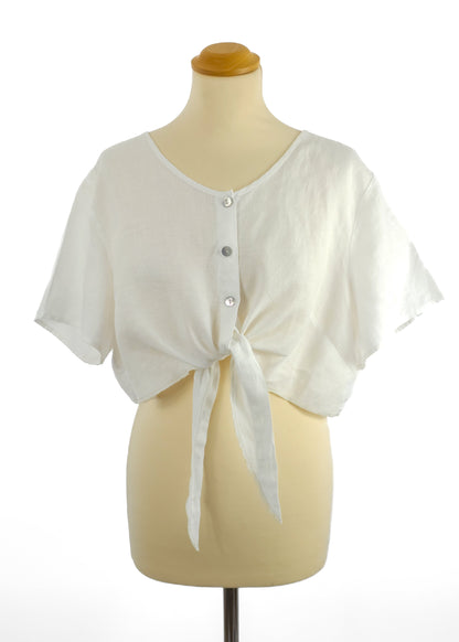 White button-down crop top with tie front on a mannequin.