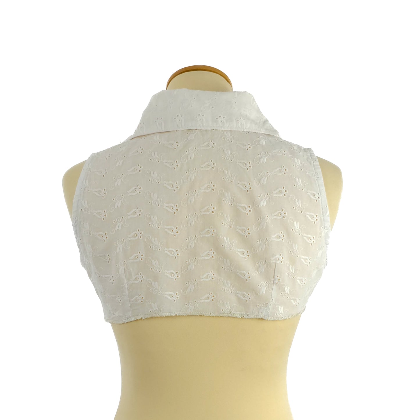 White sleeveless eyelet lace cropped vest with a high collar, displayed on a mannequin, showing the back view.