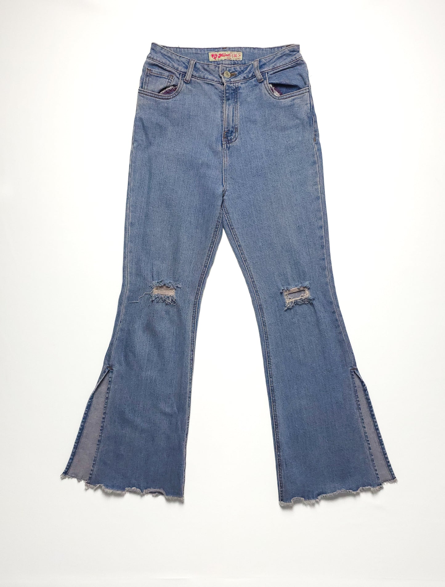 Vintage blue flare jeans with distressed details and a high waist.