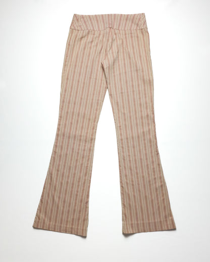 Beige and red striped flared pants with a high waistband, laid flat on a white surface. The pants feature a subtle pattern and a stylish, retro flair.