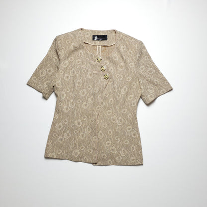 Vintage beige blouse with short sleeves and decorative buttons.